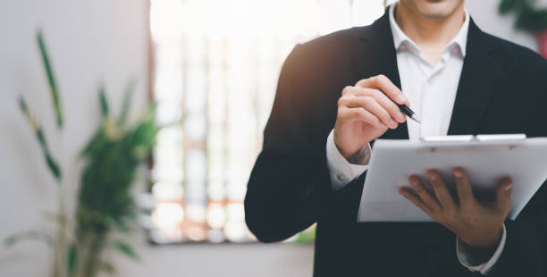business accounting documents,auditor,management and auditing of office documents,Reports for Tax Time Analysis, Office worker working with documents, pre-approval quality assessment